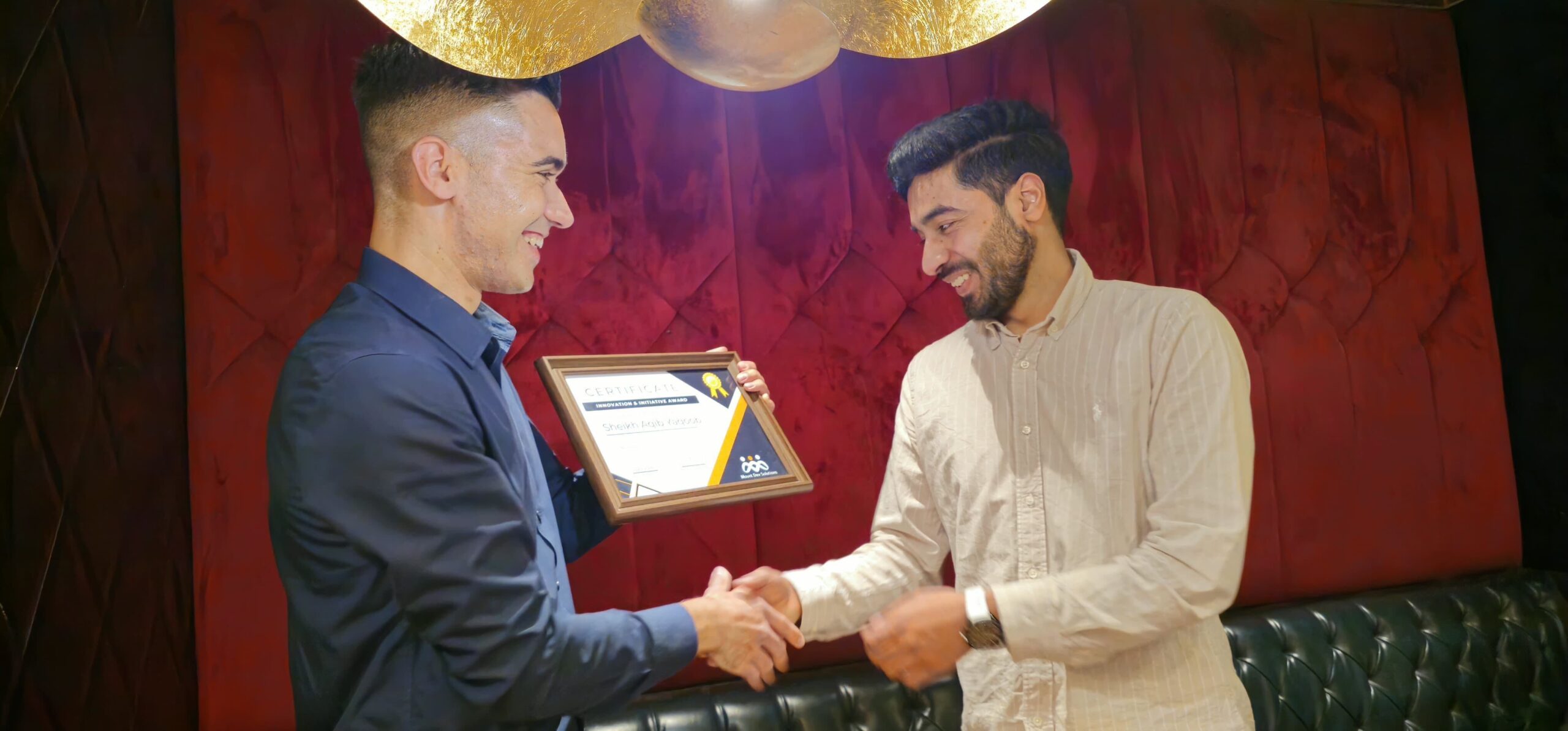 Aqib Yaqoob (right) receiving